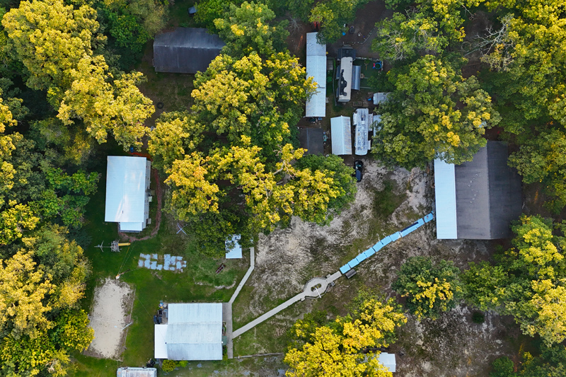 Aerial view of Camp Aura property and facilities at sunset in Monroeville, NJ