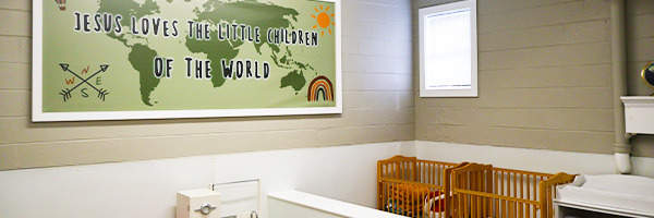 Jesus Loves the Little Children of the World banner in church nursery